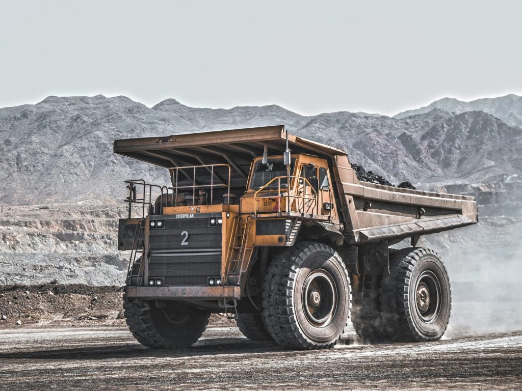 Caterpillar haul truck hauling ore at a mine site