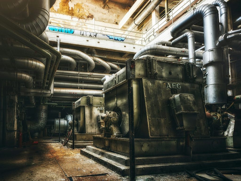 Industrial engine room with large generators and piping